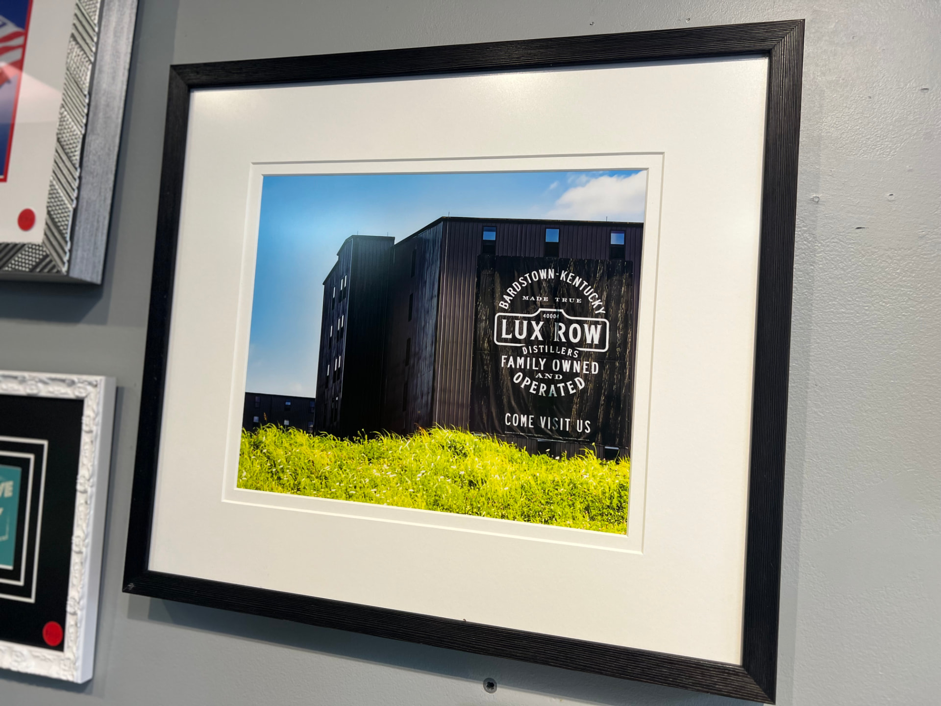 Framed photograph of the Lux Row Distillers rickhouse in Bardstown with a double white mat and black frame