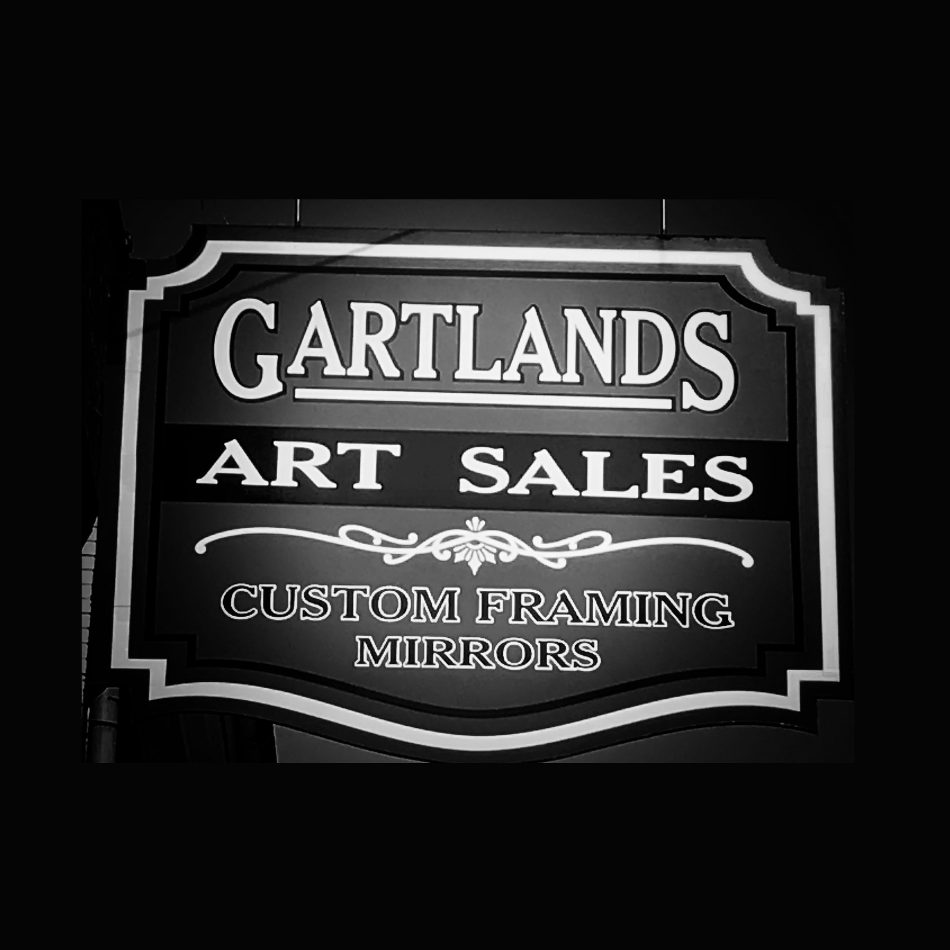 Gartlands Art Sales and Custom Framing hanging sign in downtown Bardstown, Kentucky